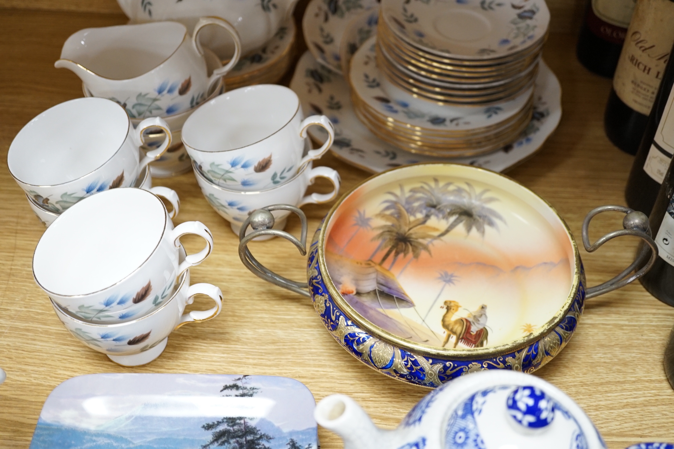 A Noritake ‘Egypt sunset scene’ bowl, a blue and white teapot and a Colclough teaset together with a set of four Bradex rectangular “Wild Wings” plates, 22cm high
